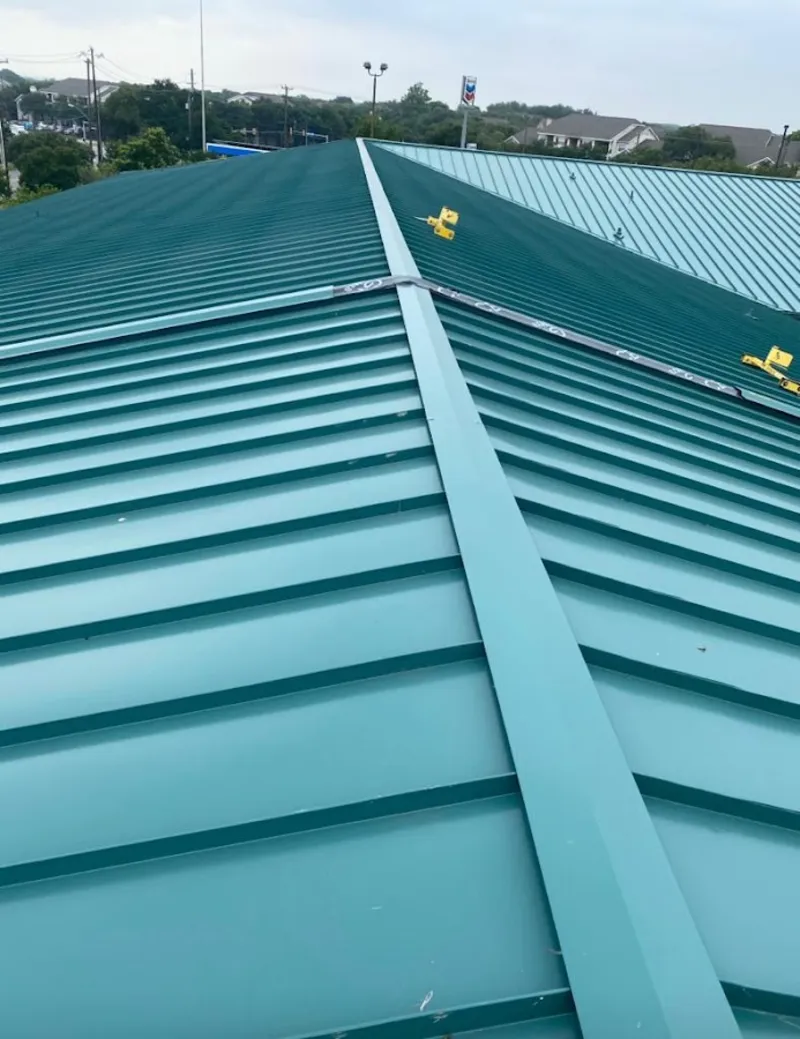 Green commercial metal roof ridge and valley for Metal Roof Repair in Moody